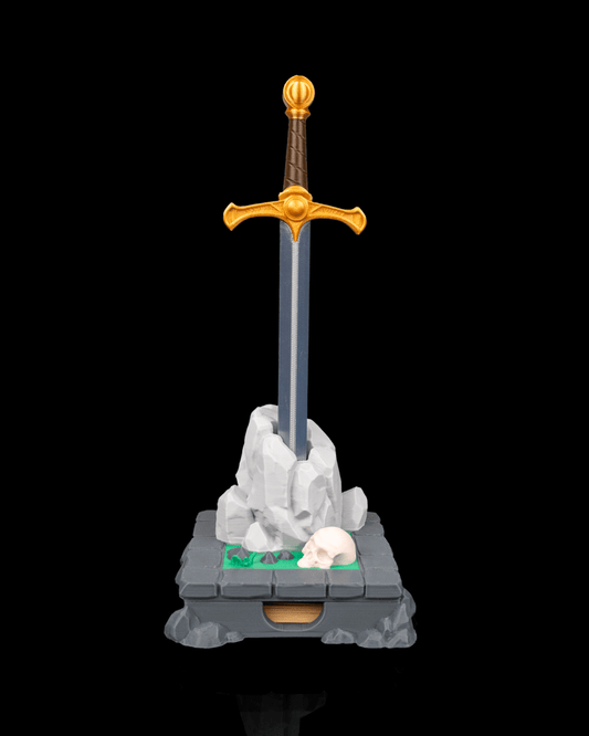 Deskalibur Pen Holder featuring a sword embedded in a rock with a skull, perfect for organizing pens and sticky notes.