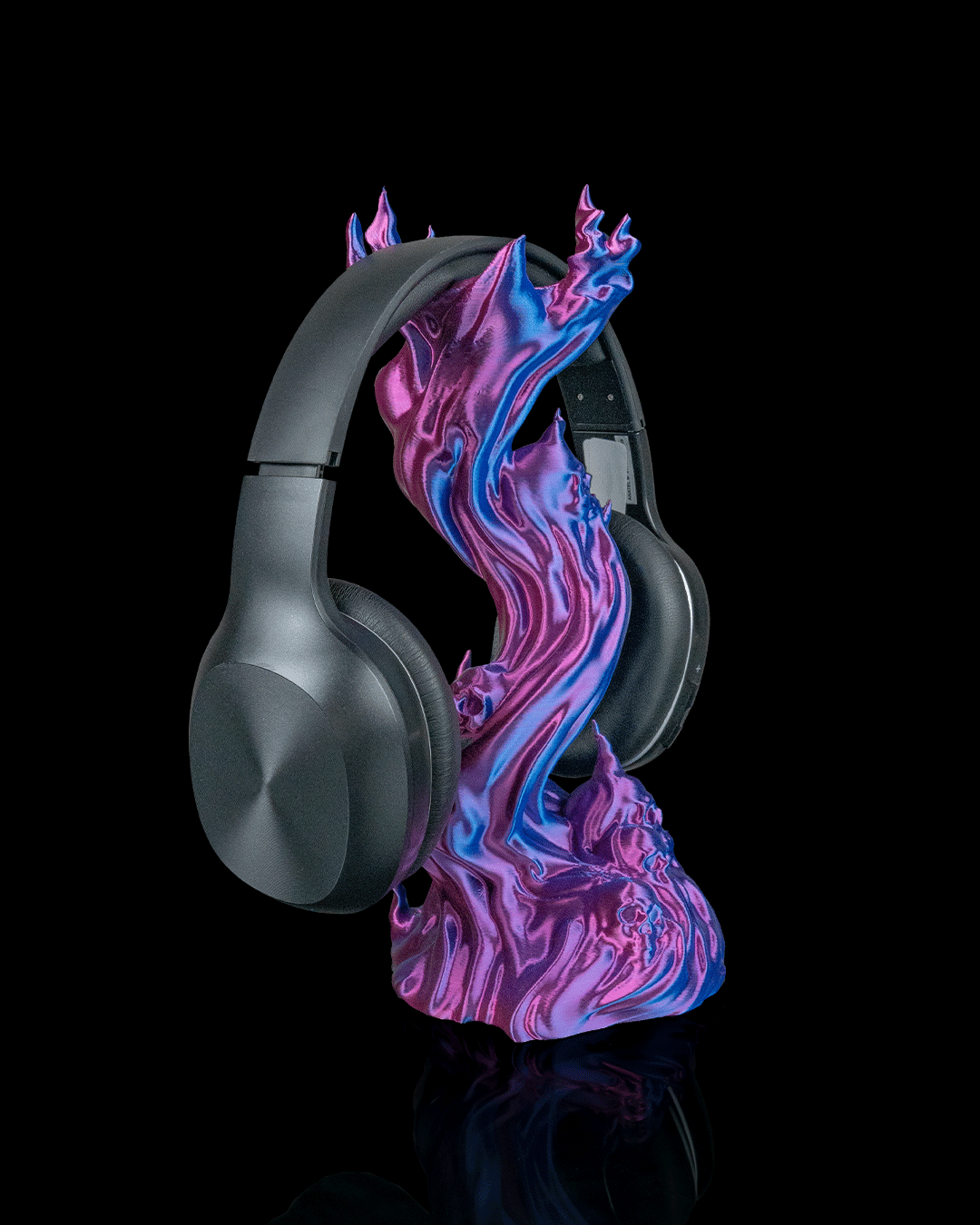 Skullflame Headphone Holder displayed with headphones on a colorful arcane stand.